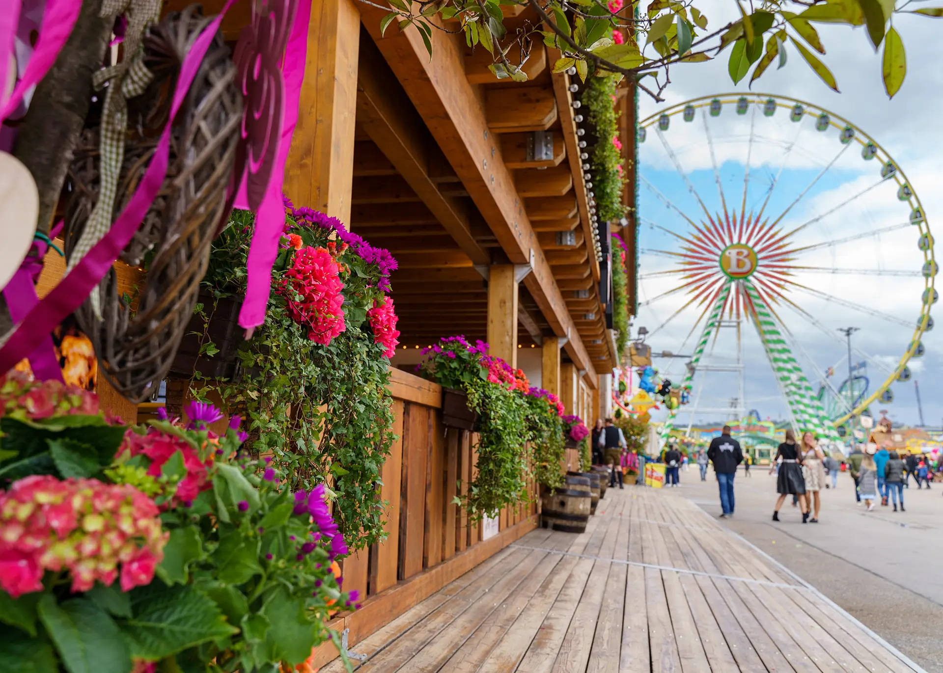amusement park with ticket sales booths and food concession stands serving visitors
